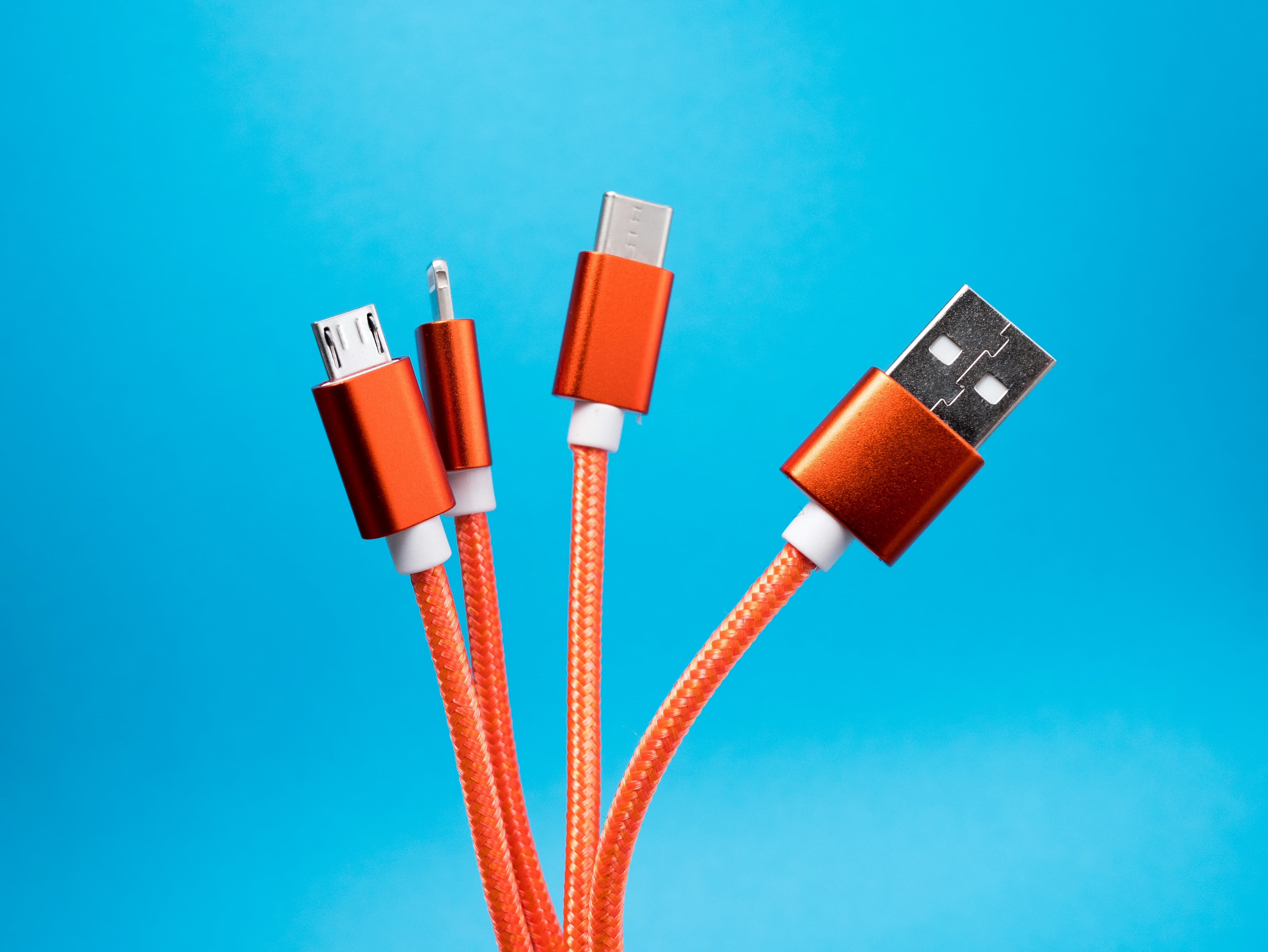 A bundle of braided charging cables with USB-A, USB-C, and micro-USB connectors